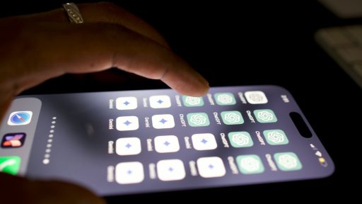 a close up of a person touching a cell phone